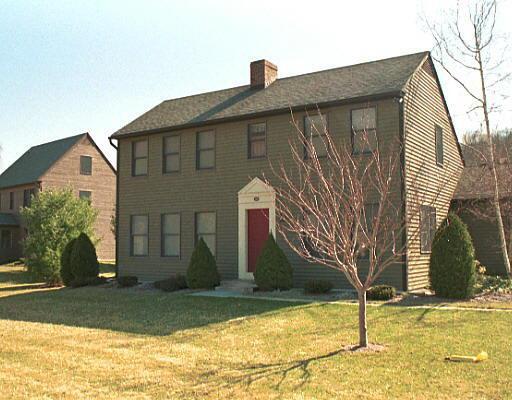 433 Kent Cornwall Road, Unit 28 Kent, CT 06757 - Photo 1 of 1 a front view of a house with a yard