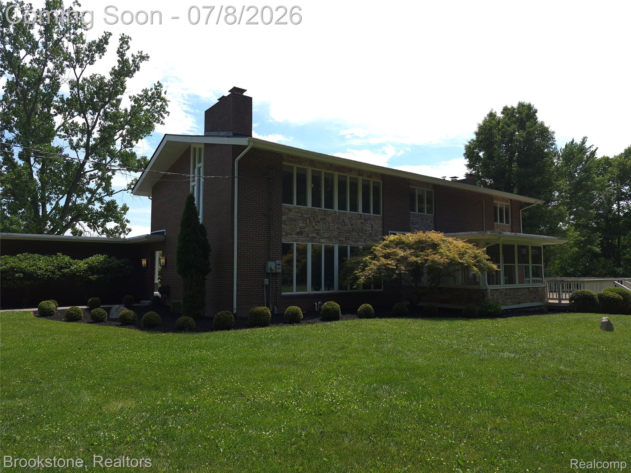 4140 South Henderson Road Davison, MI 48423 - Photo 86 of 98 Brick exterior featuring stone accents and multiple large windows