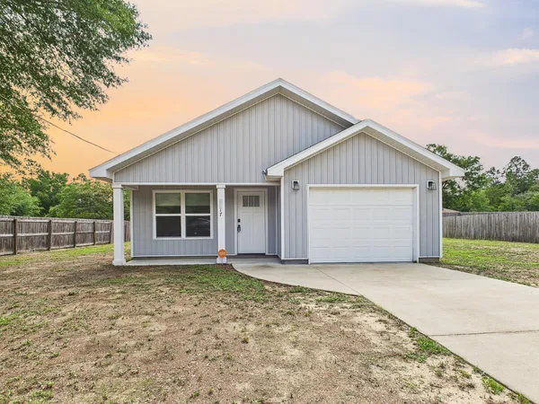 front view of a house with a yard