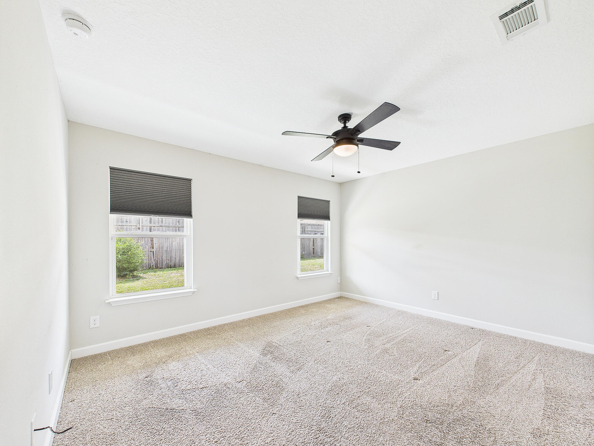 5117 Colt Drive Crestview, FL 32539 - Photo 14 of 32 a view of a big room with windows and ceiling fan