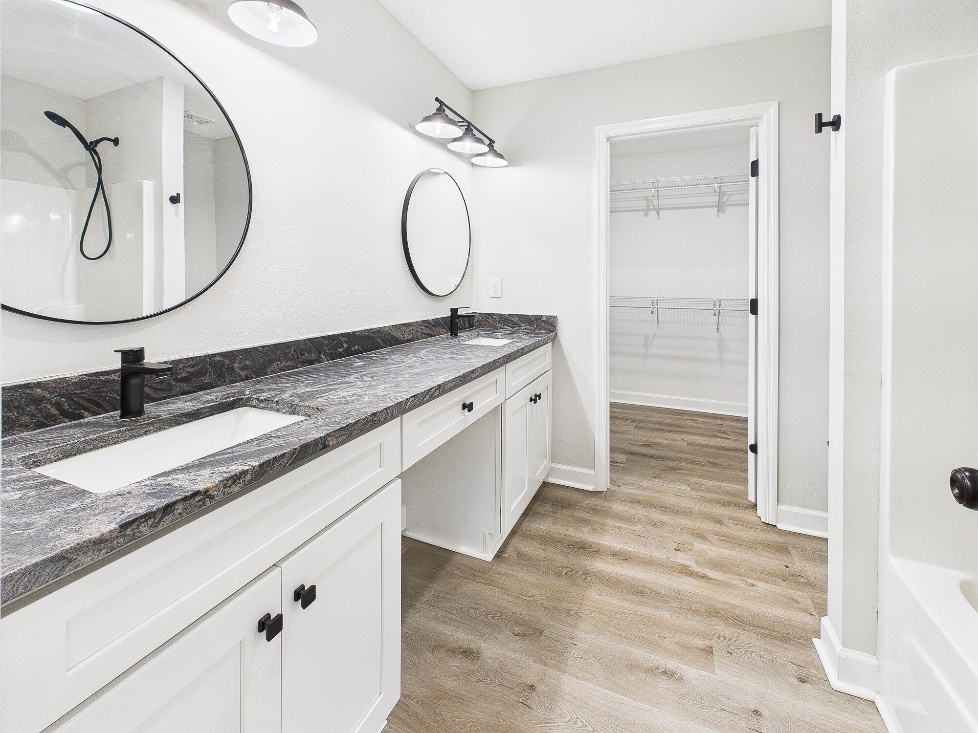 5117 Colt Drive Crestview, FL 32539 - Photo 16 of 32 a bathroom with a granite countertop sink and a mirror