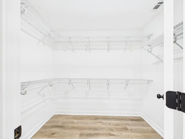 a view of a room with racks on the wall
