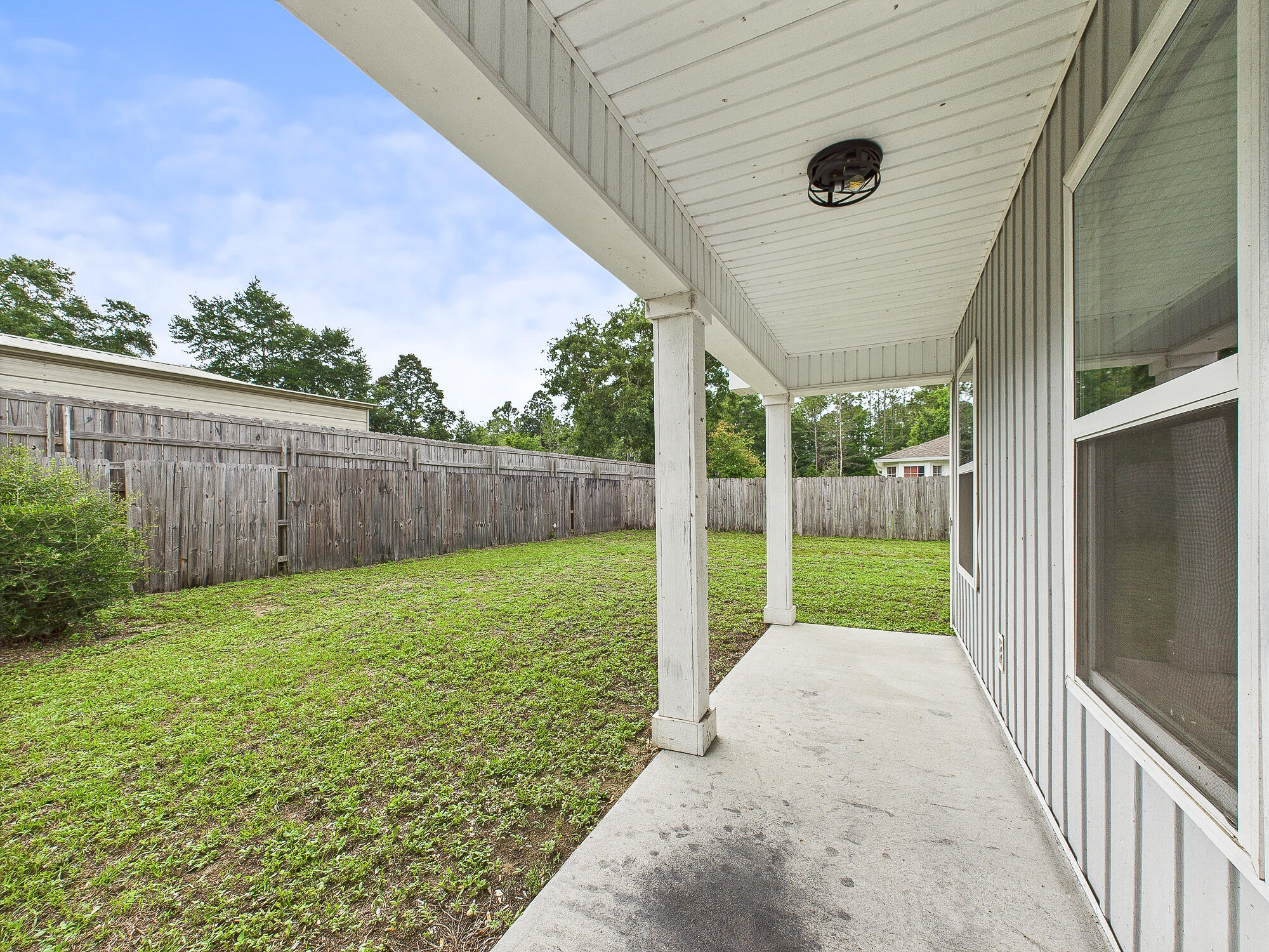 5117 Colt Drive Crestview, FL 32539 - Photo 30 of 32 a view of a backyard with a garden