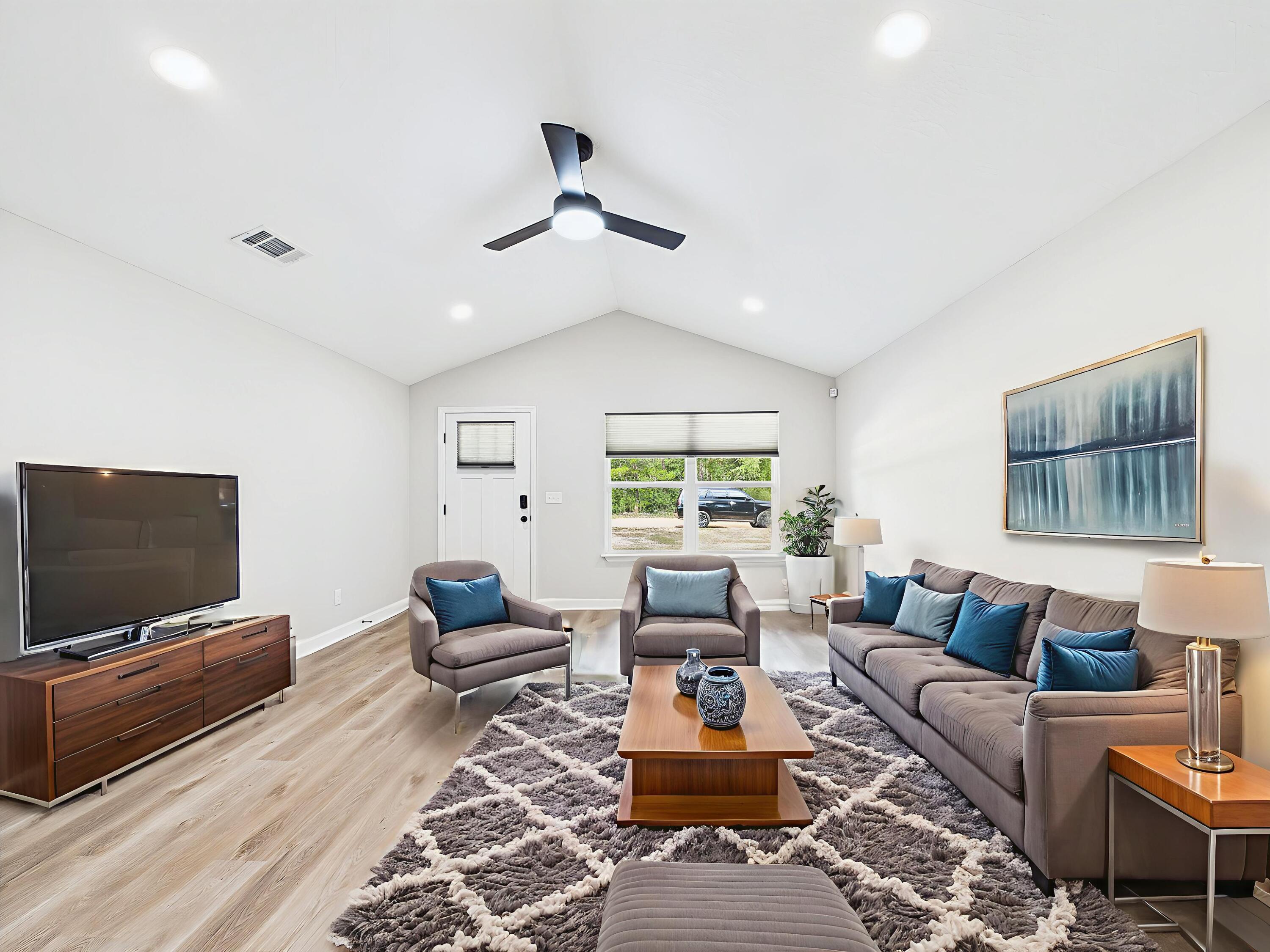 5117 Colt Drive Crestview, FL 32539 - Photo 3 of 32 a living room with furniture and a flat screen tv