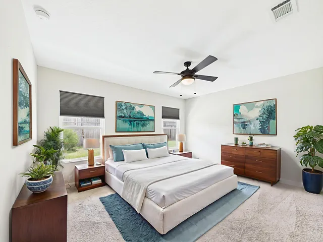 a bedroom with a large bed and a couch