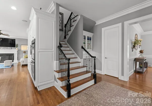 a view of entryway and hall with wooden floor