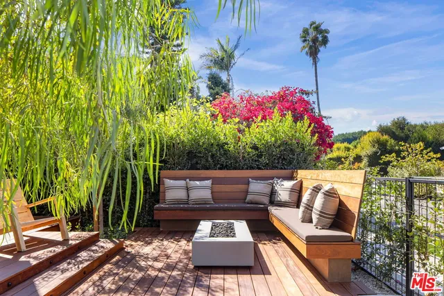 a view of a roof deck with couches