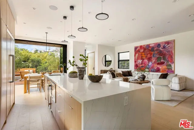 a view of a dining hall with furniture and chandelier