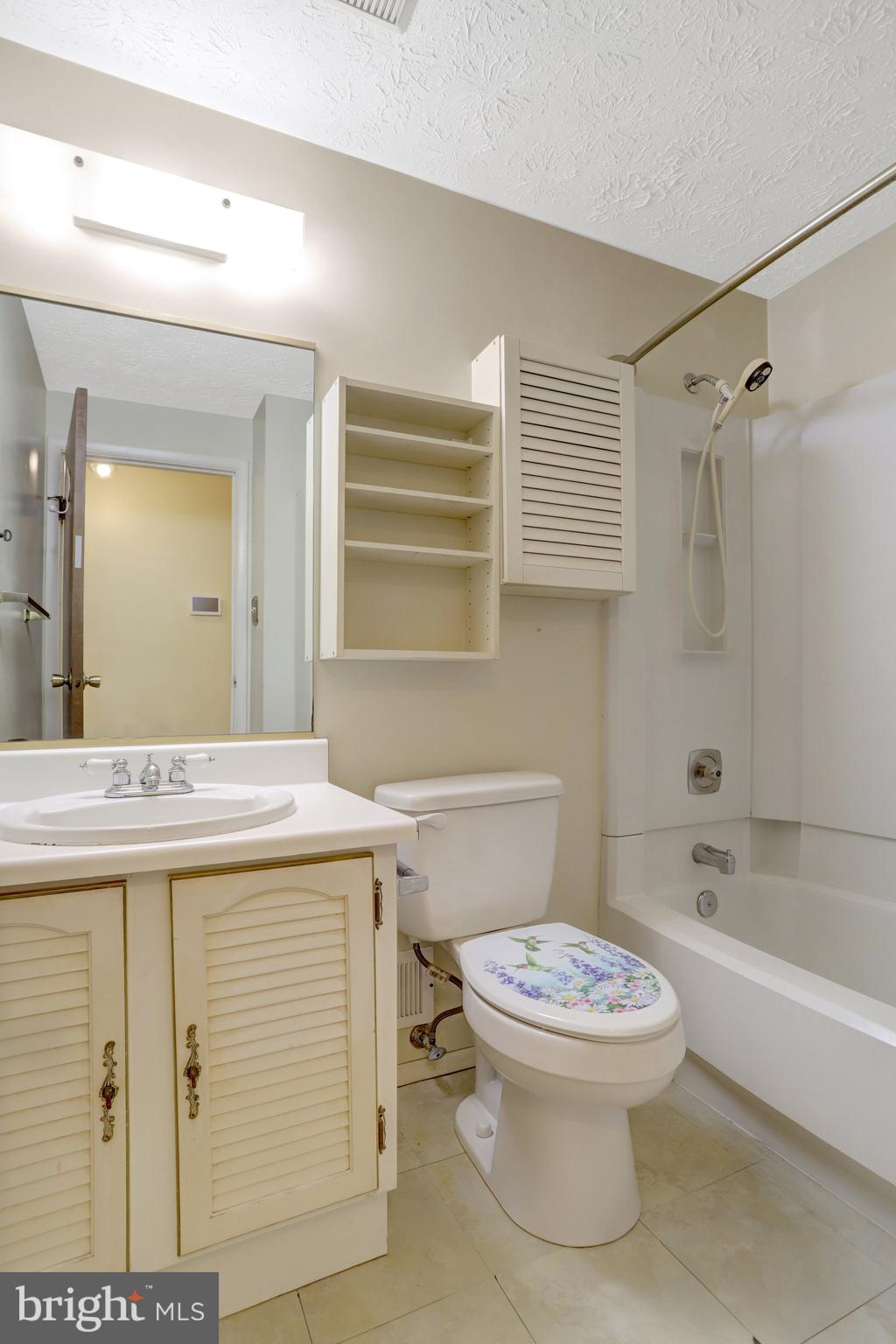 7615 Springfield Hills Drive Springfield, VA 22153 - Photo 36 of 71 a bathroom with a sink a toilet and shower