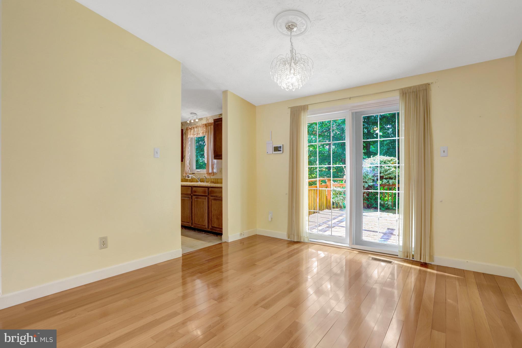 7615 Springfield Hills Drive Springfield, VA 22153 - Photo 9 of 71 a view of an empty room with a window