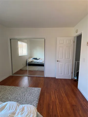 a view of livingroom with hardwood floor and hallway