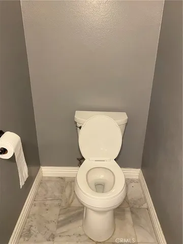 a bathroom with a toilet and a sink