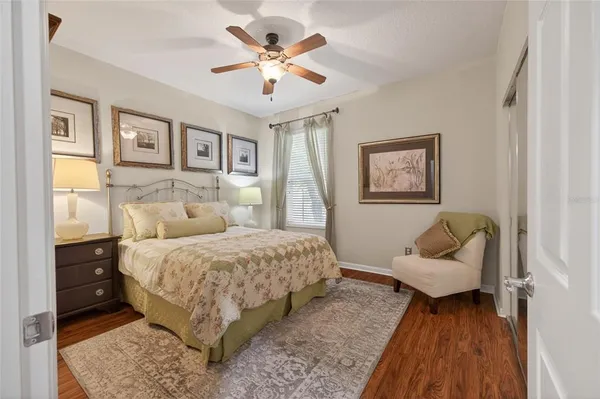 a bedroom with a bed and a couch