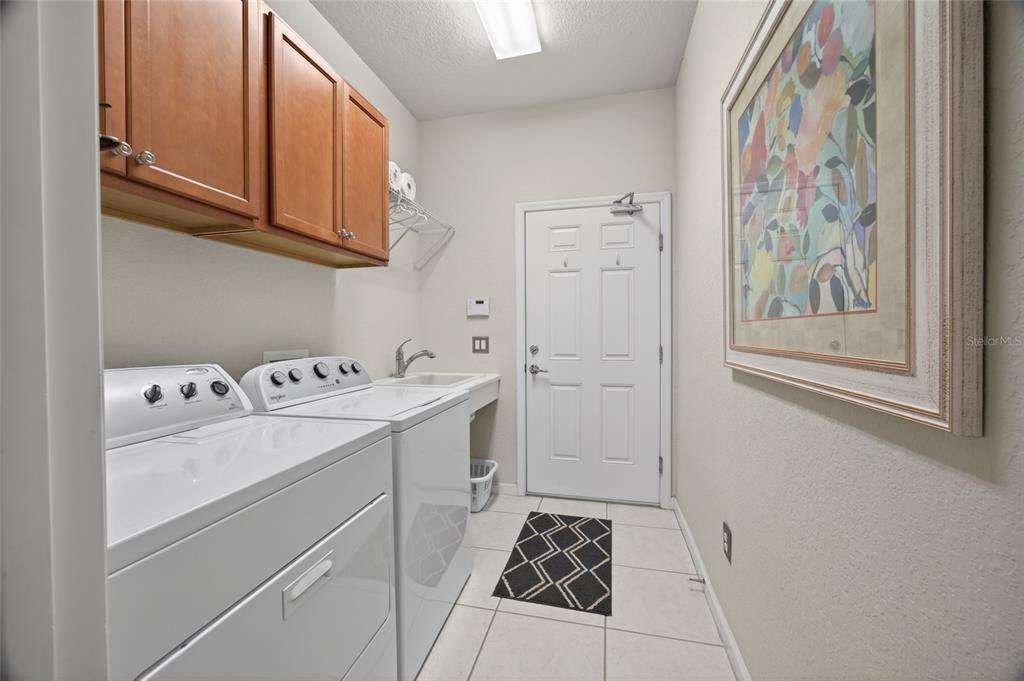 9106 Southwest 65th Loop Ocala, FL 34481 - Photo 19 of 38 a utility room with dryer and washer