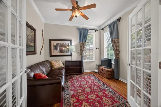 a living room with furniture and a rug