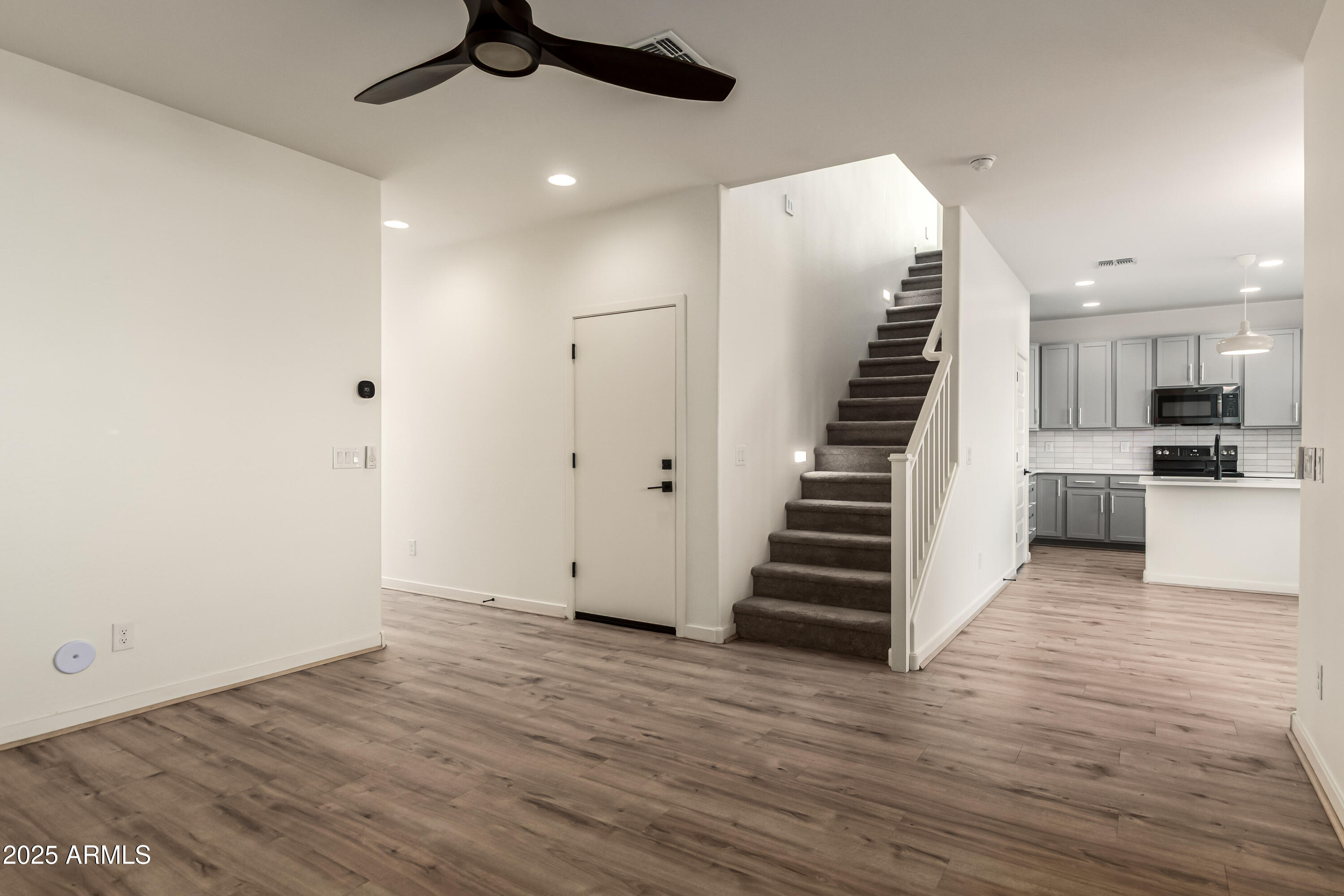 20 East Main Street Mesa, AZ 85201 - Photo 14 of 46 a view of a kitchen with wooden floor and staircase