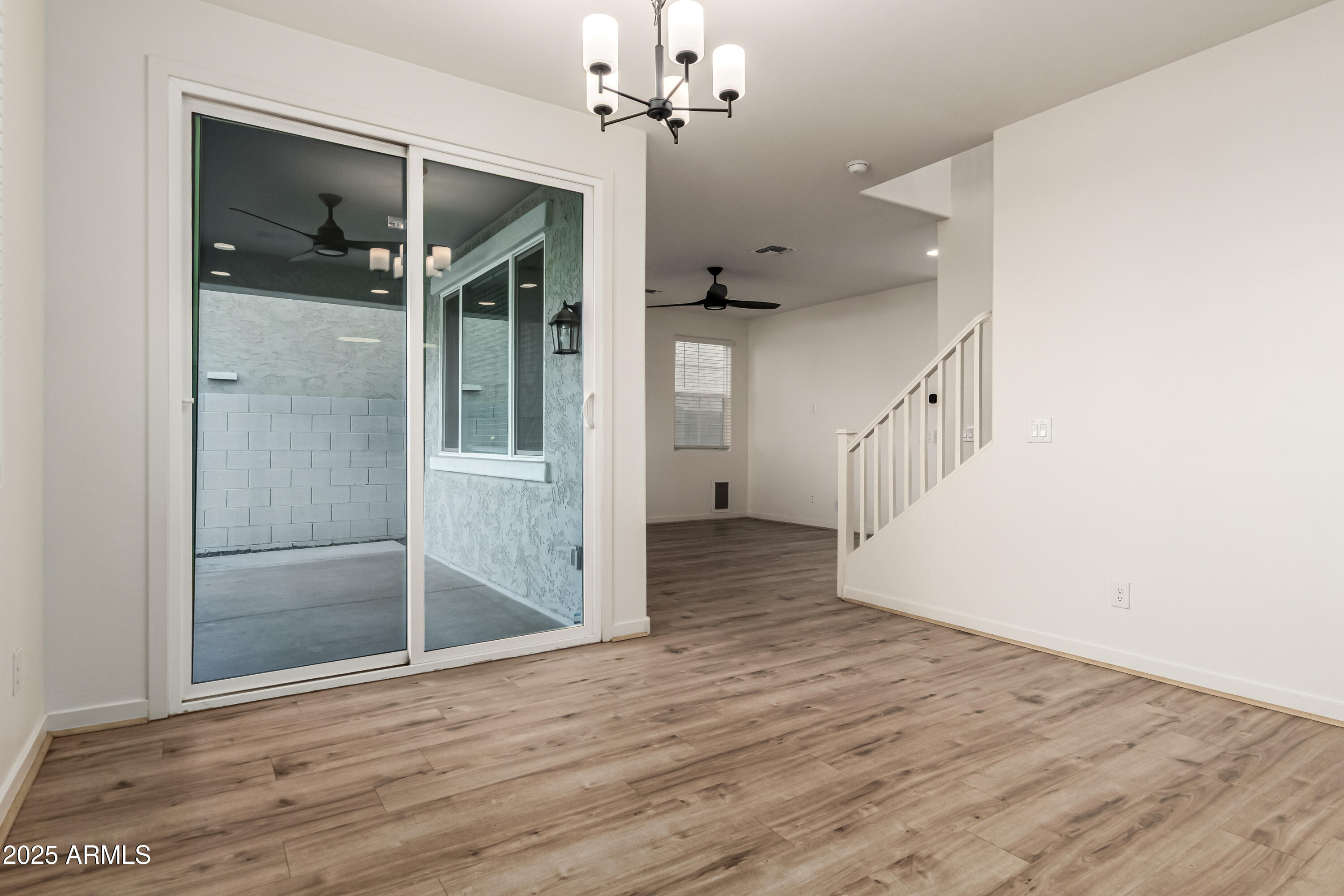 20 East Main Street Mesa, AZ 85201 - Photo 15 of 46 a view of a hallway with wooden floor and chandelier