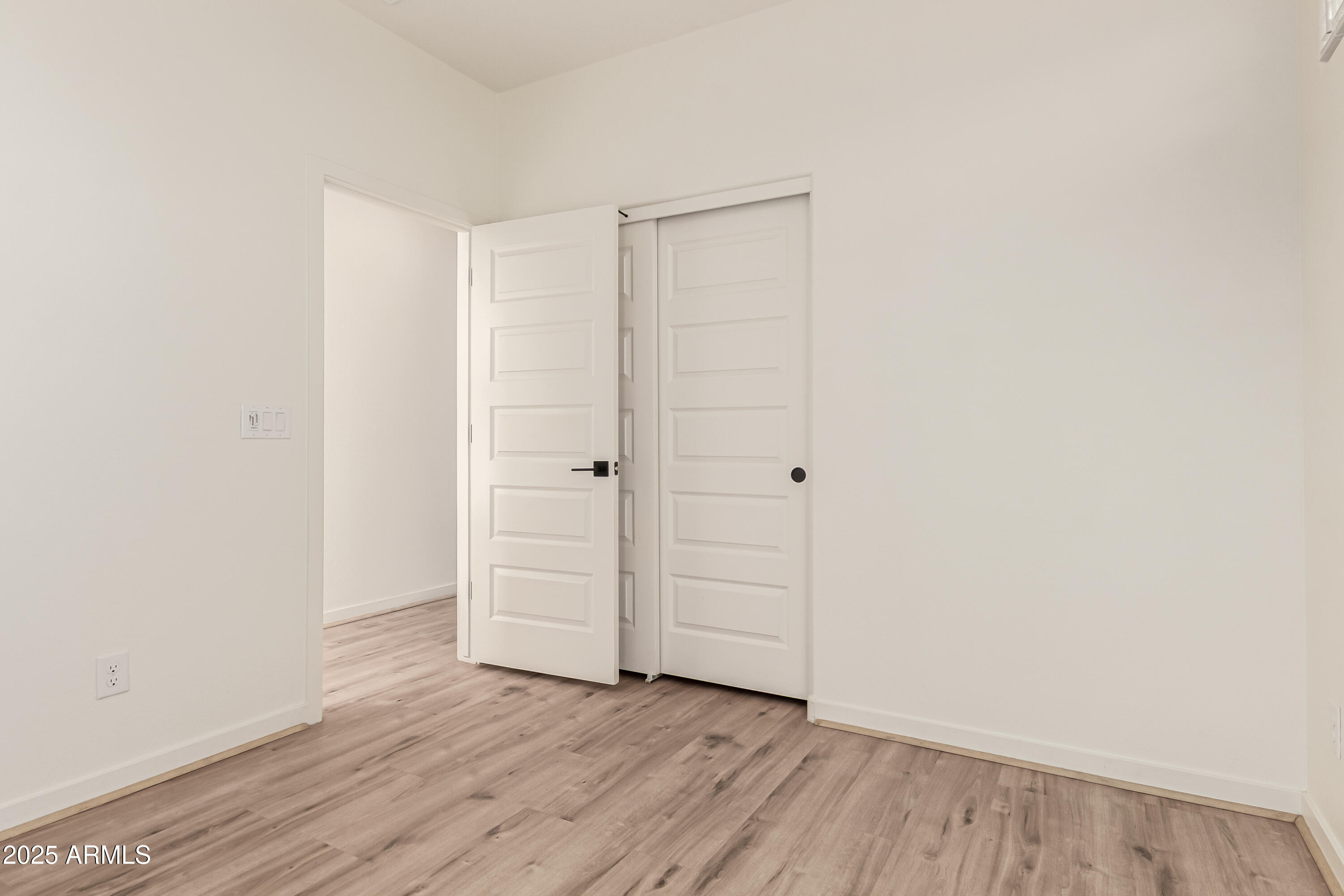 20 East Main Street Mesa, AZ 85201 - Photo 22 of 46 an empty room with wooden floor