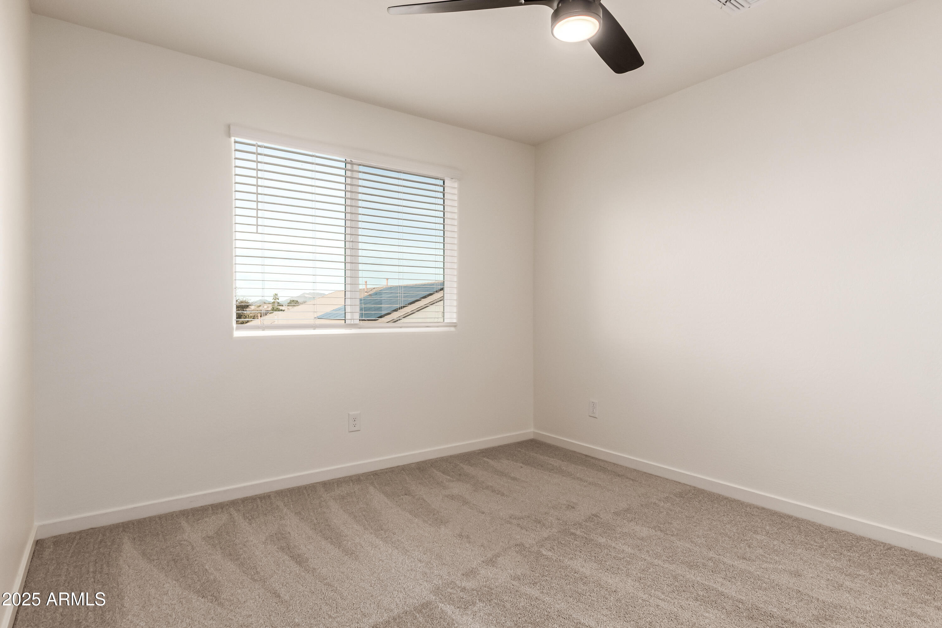 20 East Main Street Mesa, AZ 85201 - Photo 34 of 46 an empty room with windows and fan