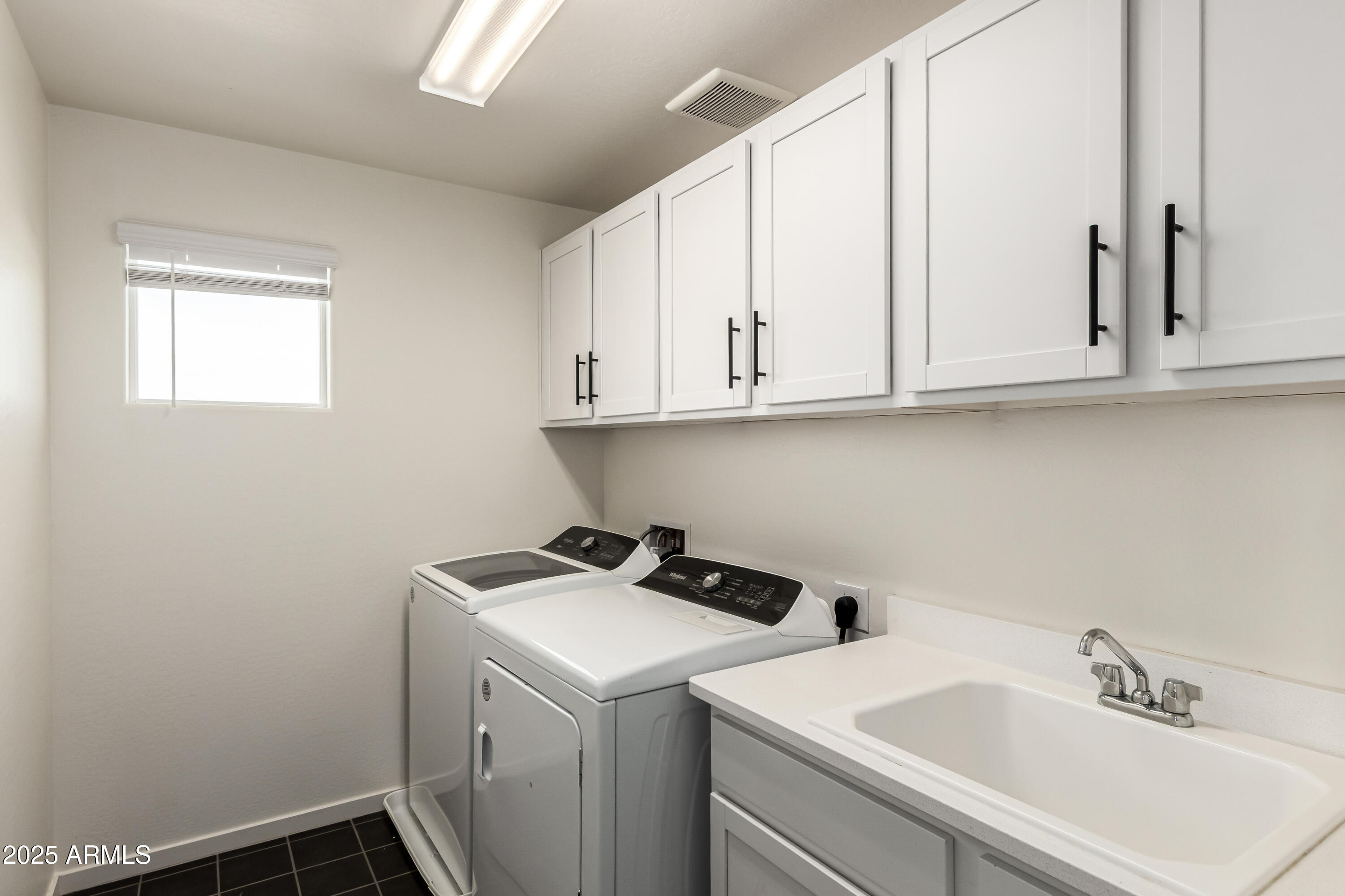 20 East Main Street Mesa, AZ 85201 - Photo 37 of 46 a utility room with sink dryer and washer