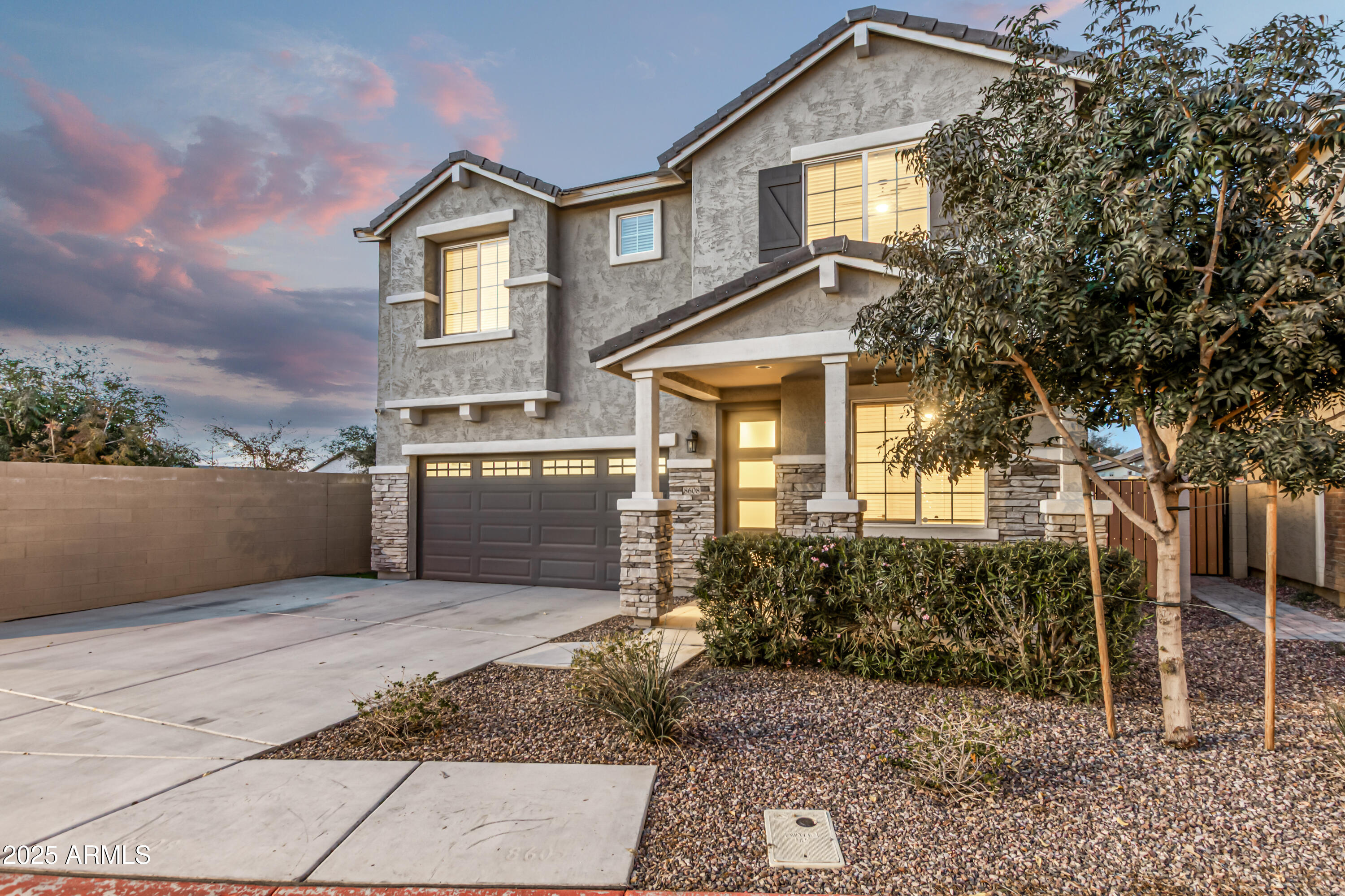 20 East Main Street Mesa, AZ 85201 - Photo 6 of 46 a front view of a house with a yard and garage