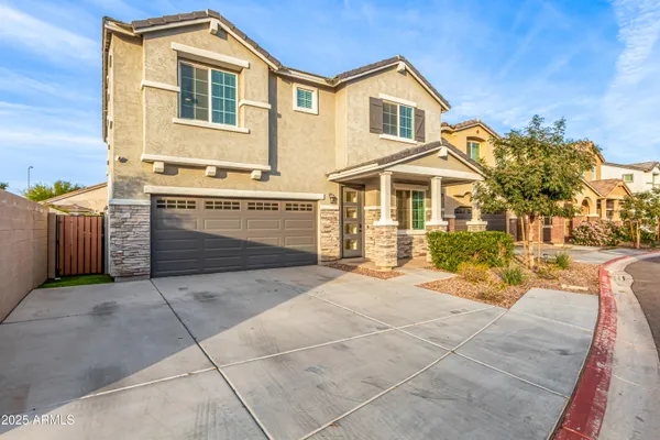 a view of a kitchen with wooden floor and staircase