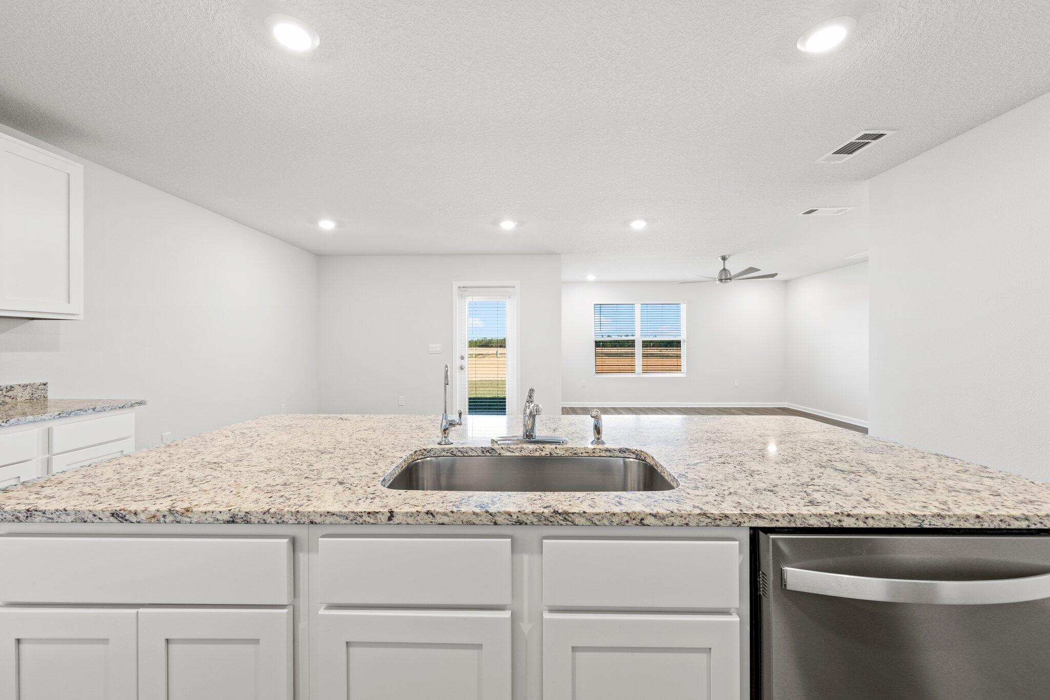 733 Quintana Street Crestview, FL 32539 - Photo 12 of 25 a bathroom with a granite countertop sink and a granite