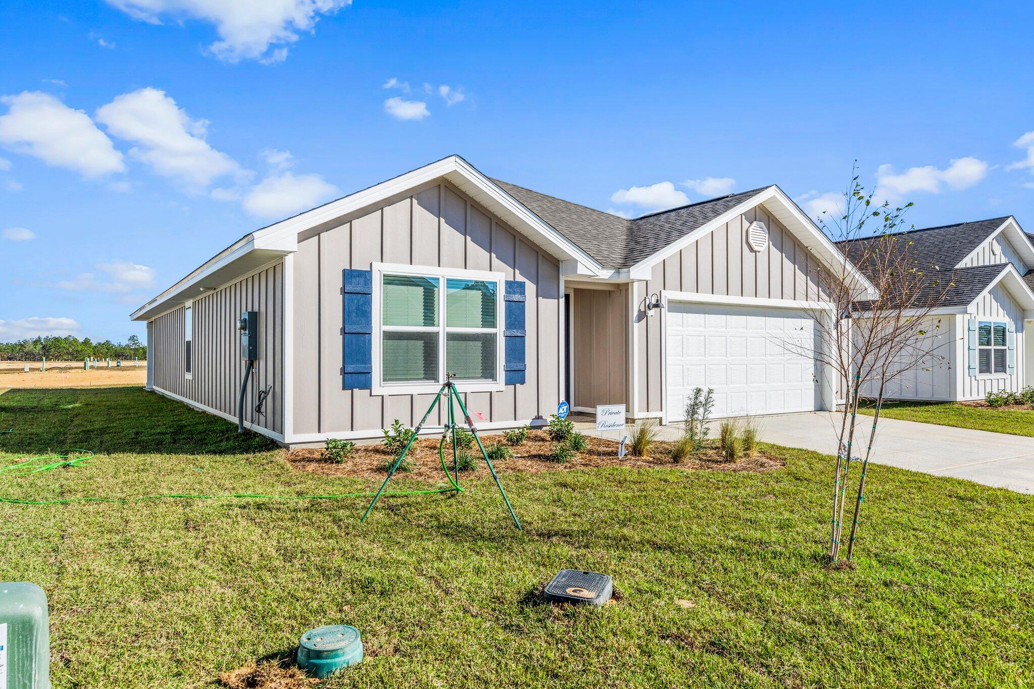 733 Quintana Street Crestview, FL 32539 - Photo 2 of 25 a backyard of a house with table and chairs