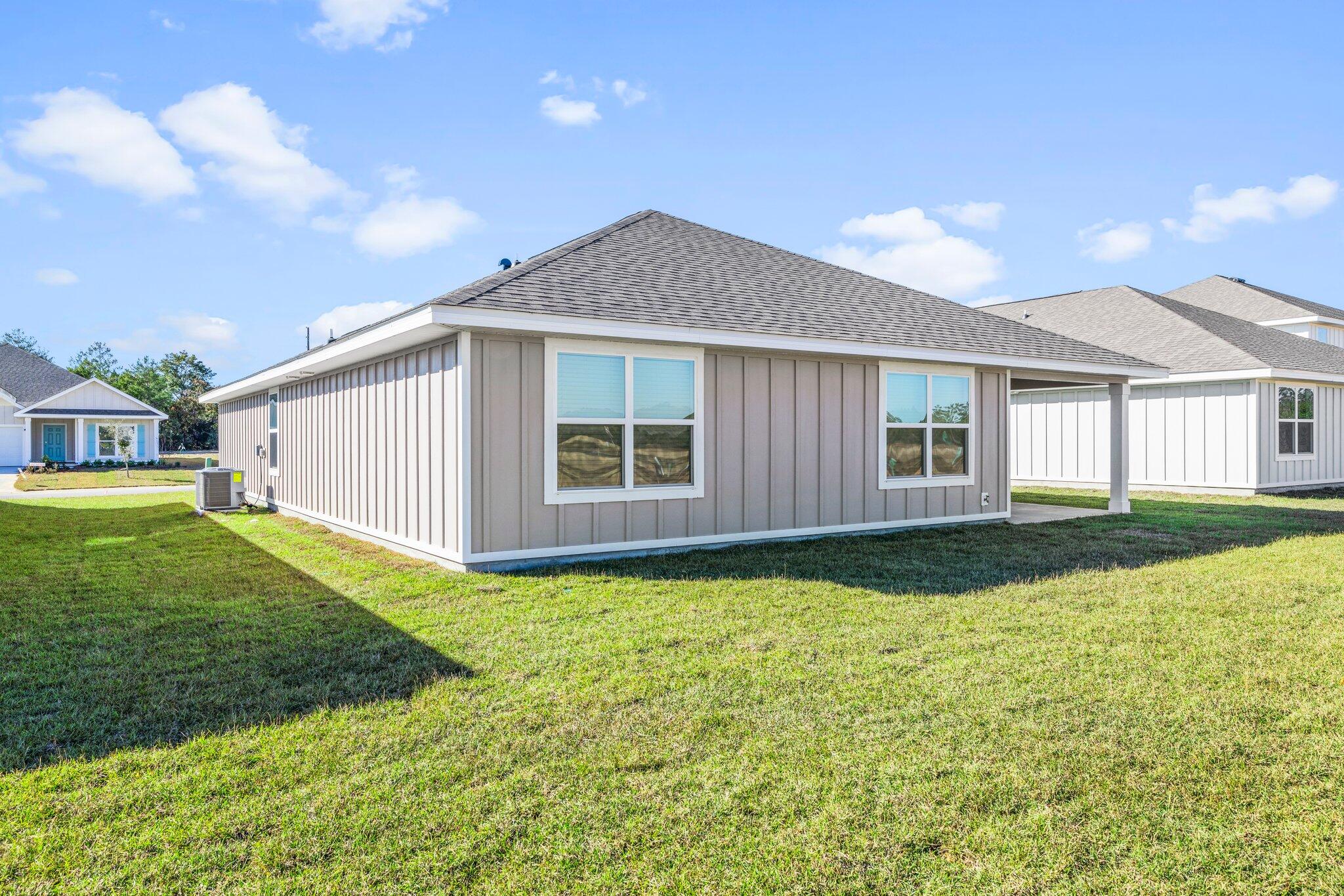 733 Quintana Street Crestview, FL 32539 - Photo 22 of 25 a front view of a house with a yard