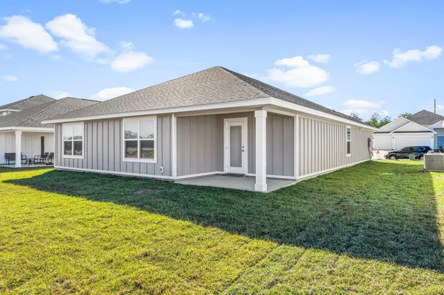 a kitchen with a sink dishwasher a refrigerator and cabinets