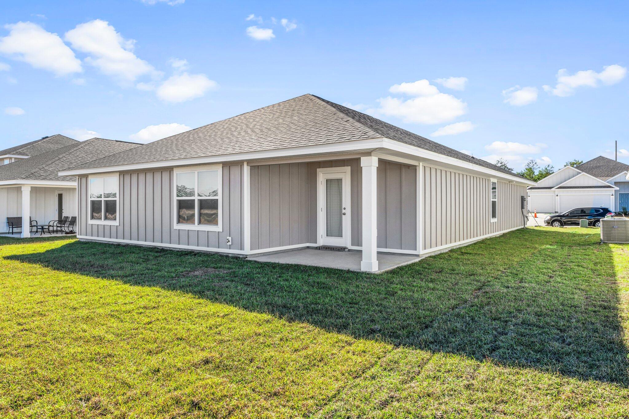 733 Quintana Street Crestview, FL 32539 - Photo 24 of 25 a view of a house with backyard and garden