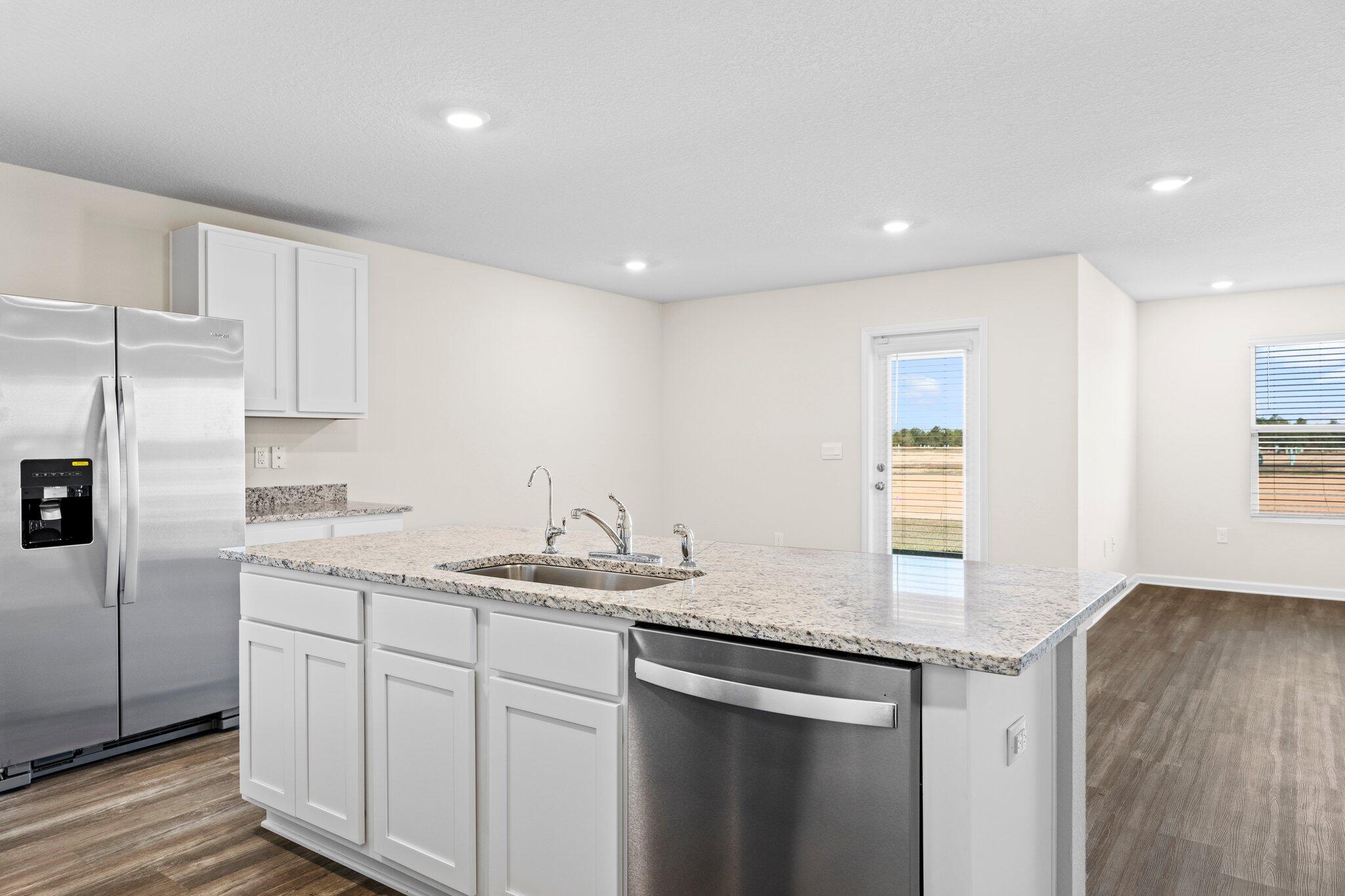 733 Quintana Street Crestview, FL 32539 - Photo 25 of 25 a kitchen with a sink dishwasher a refrigerator and cabinets