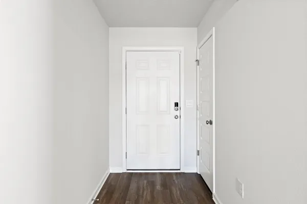 a view of front door with wooden floor