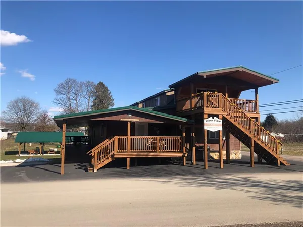 a view of outdoor space with deck and barbeque oven