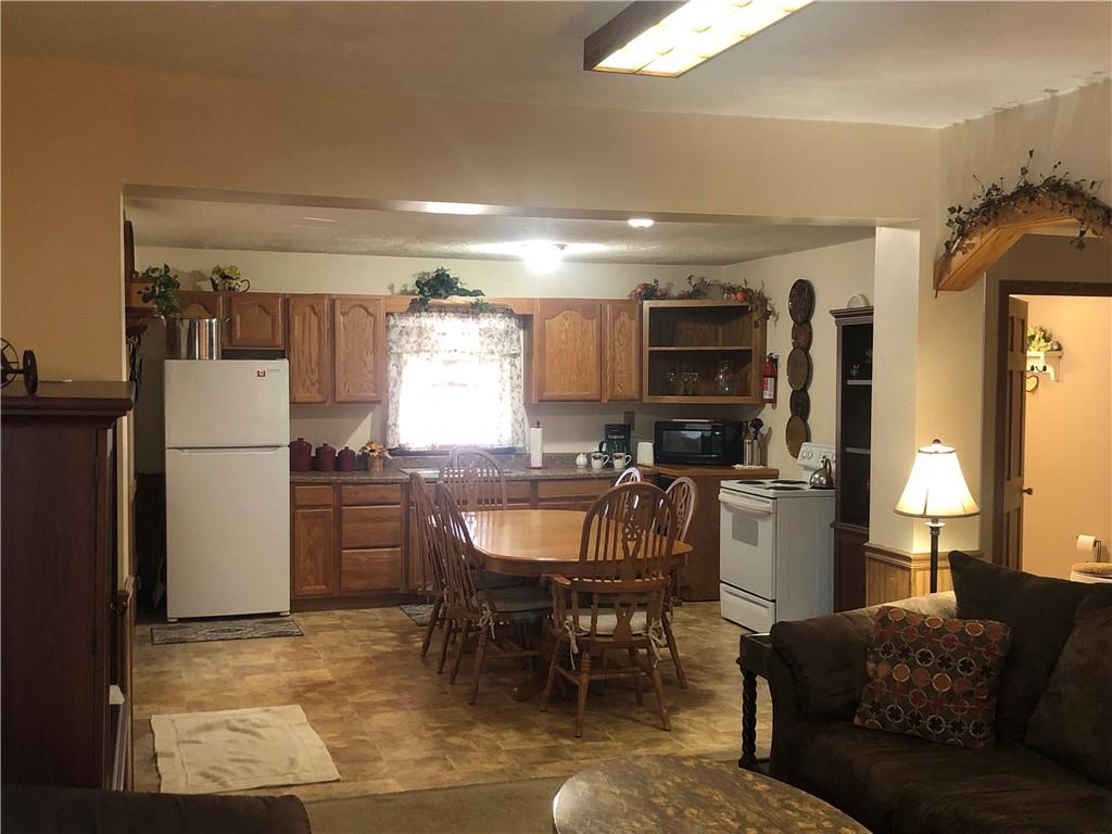 629 River Road Confluence, PA 15424 - Photo 16 of 50 a living room with furniture a window and kitchen view
