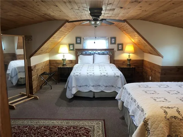 a bed room with a bed and a chandelier