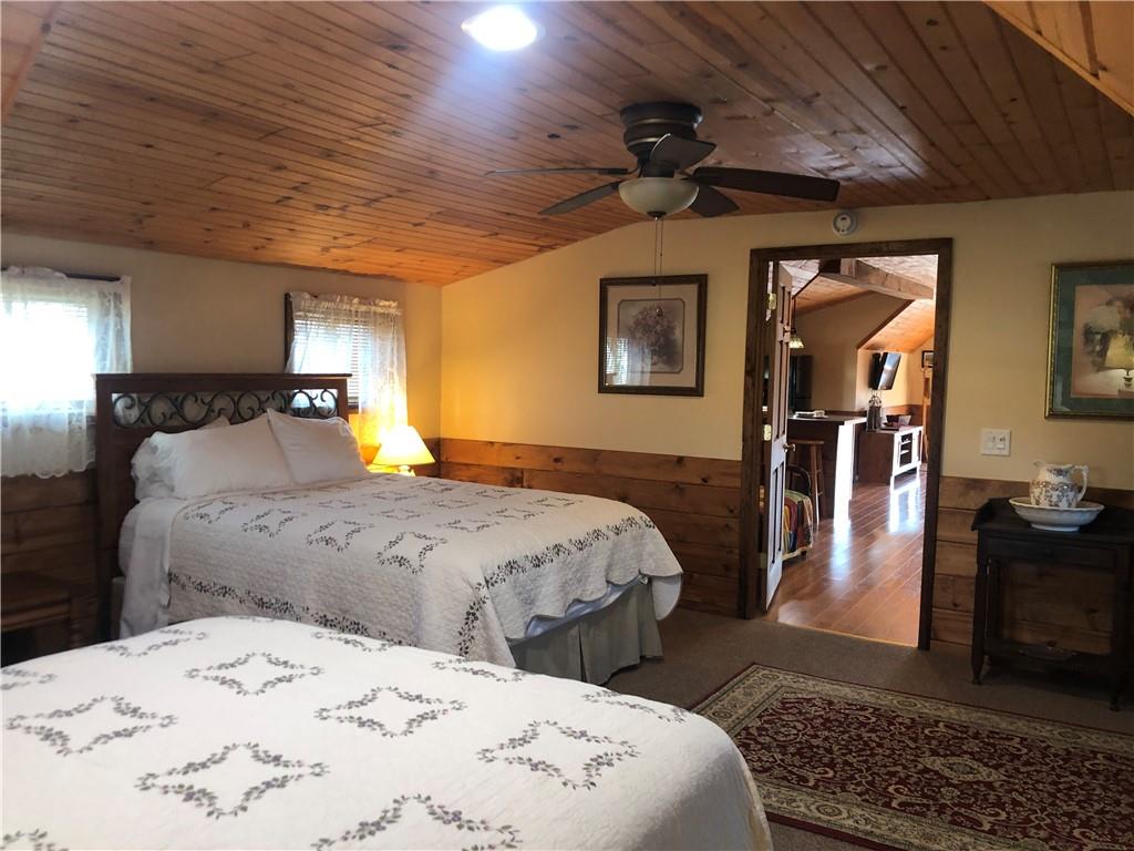 629 River Road Confluence, PA 15424 - Photo 32 of 50 a bedroom with bed and wooden floor