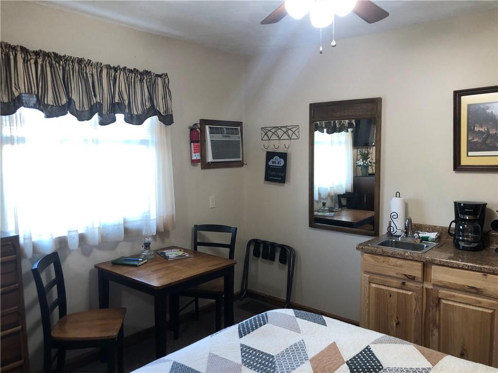 629 River Road Confluence, PA 15424 - Photo 41 of 50 a kitchen with a table chairs and a painting on the wall
