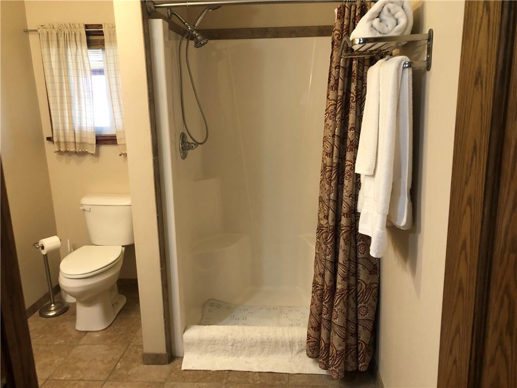 629 River Road Confluence, PA 15424 - Photo 43 of 50 a bathroom with a shower a toilet and a window