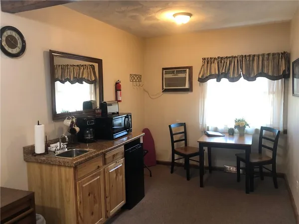 a bedroom with a bed and a mirror