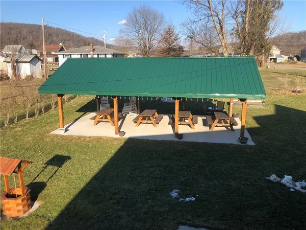 a view of a swimming pool with an outdoor space and seating area