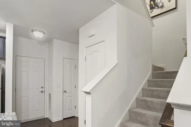 a view of staircase with white walls and white walls