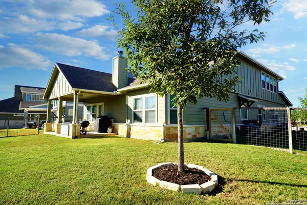 a view of a house with a yard porch and sitting area