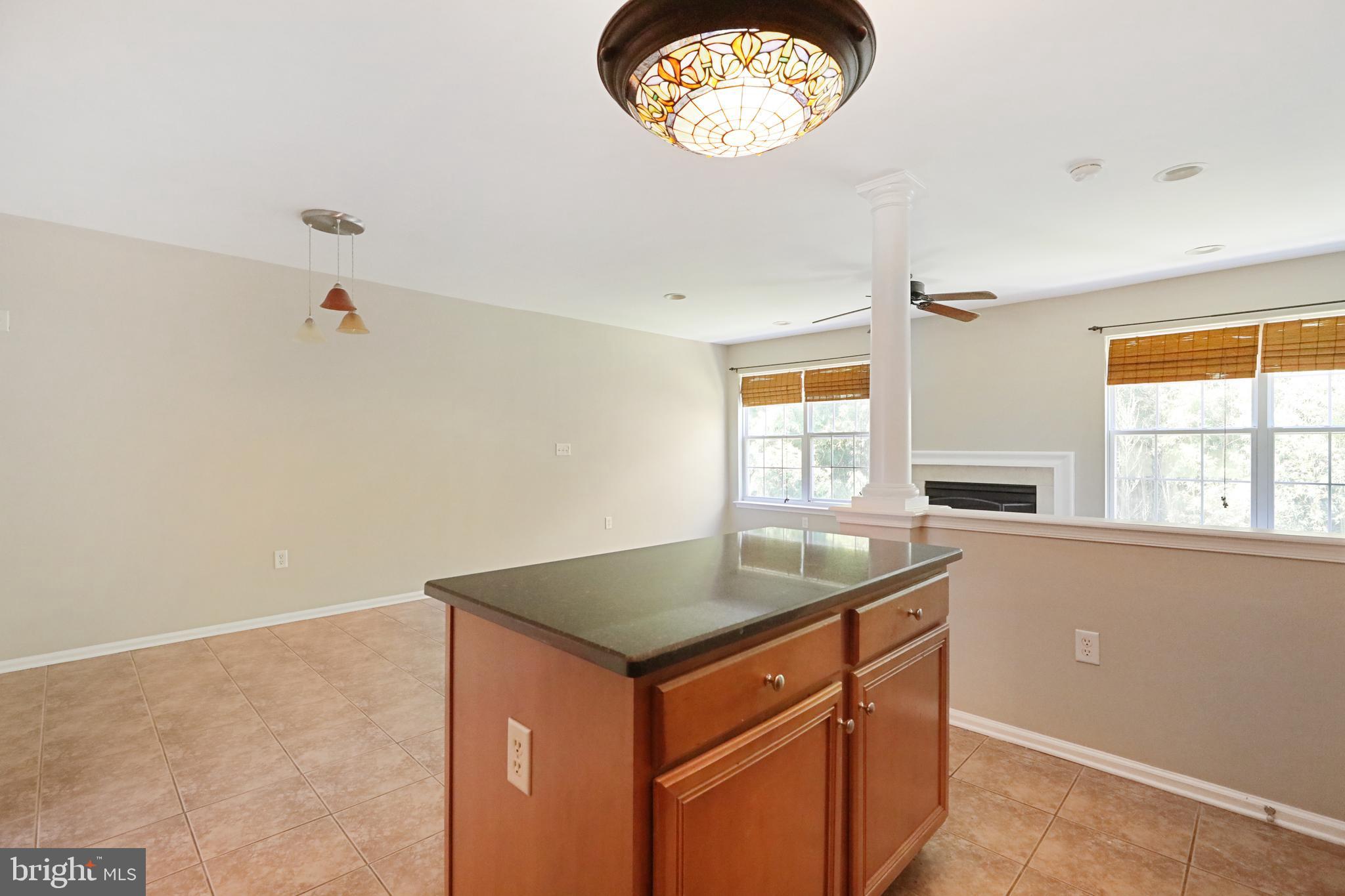 1041 Buckingham Thorofare, NJ 08086 - Photo 13 of 35 a kitchen with a sink cabinets and a window