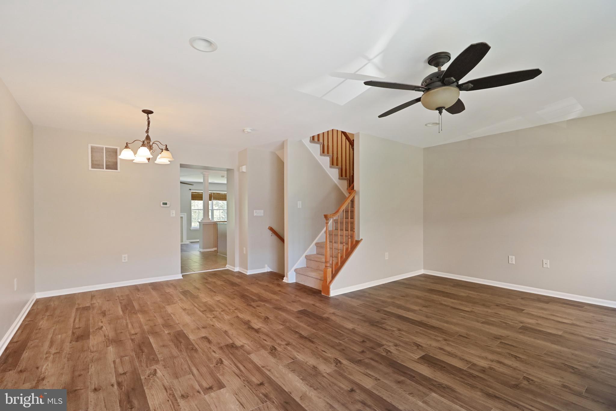 1041 Buckingham Thorofare, NJ 08086 - Photo 20 of 35 a view of a room with wooden floor and white walls