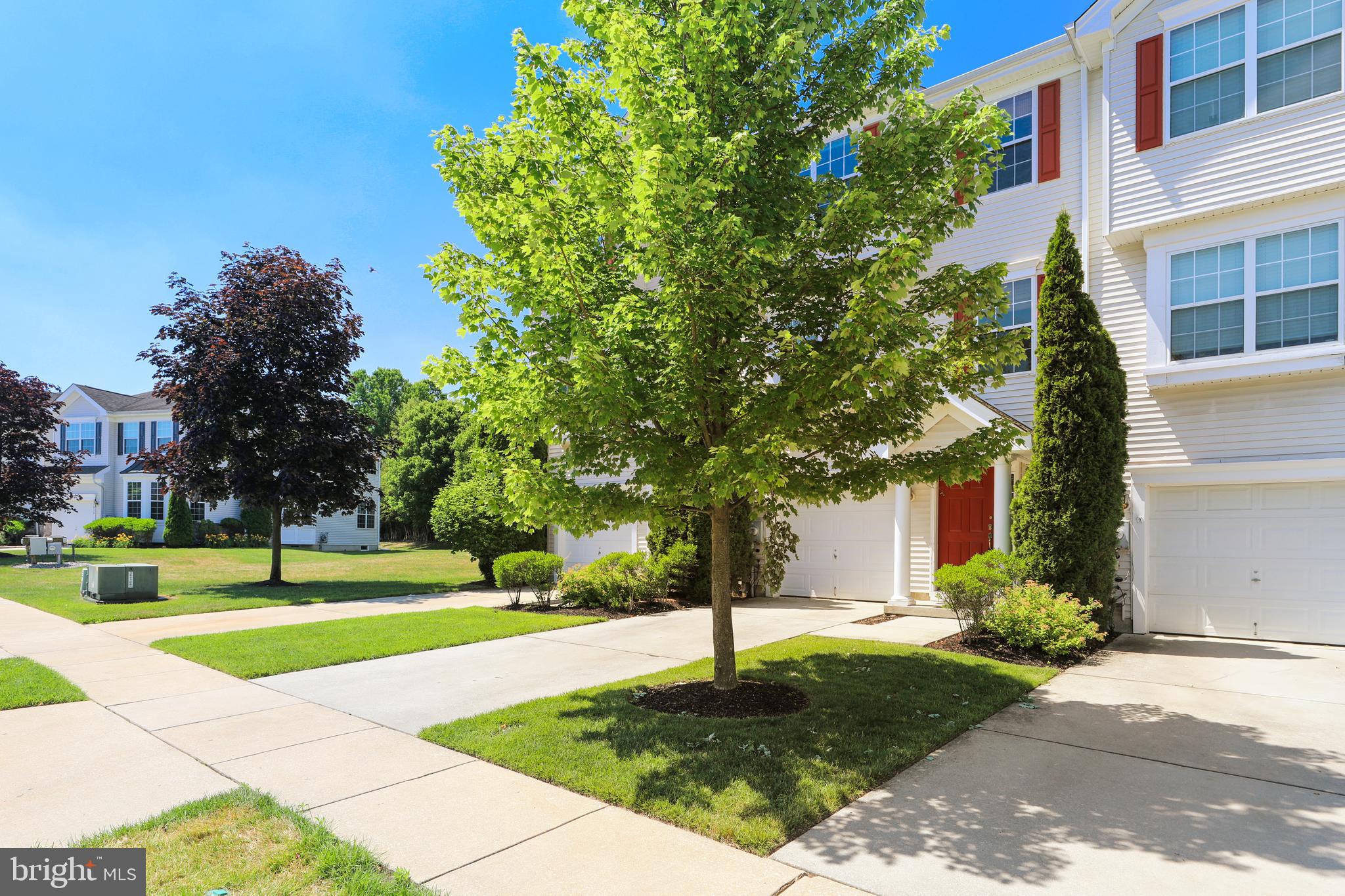 1041 Buckingham Thorofare, NJ 08086 - Photo 2 of 35 a front view of a building with trees