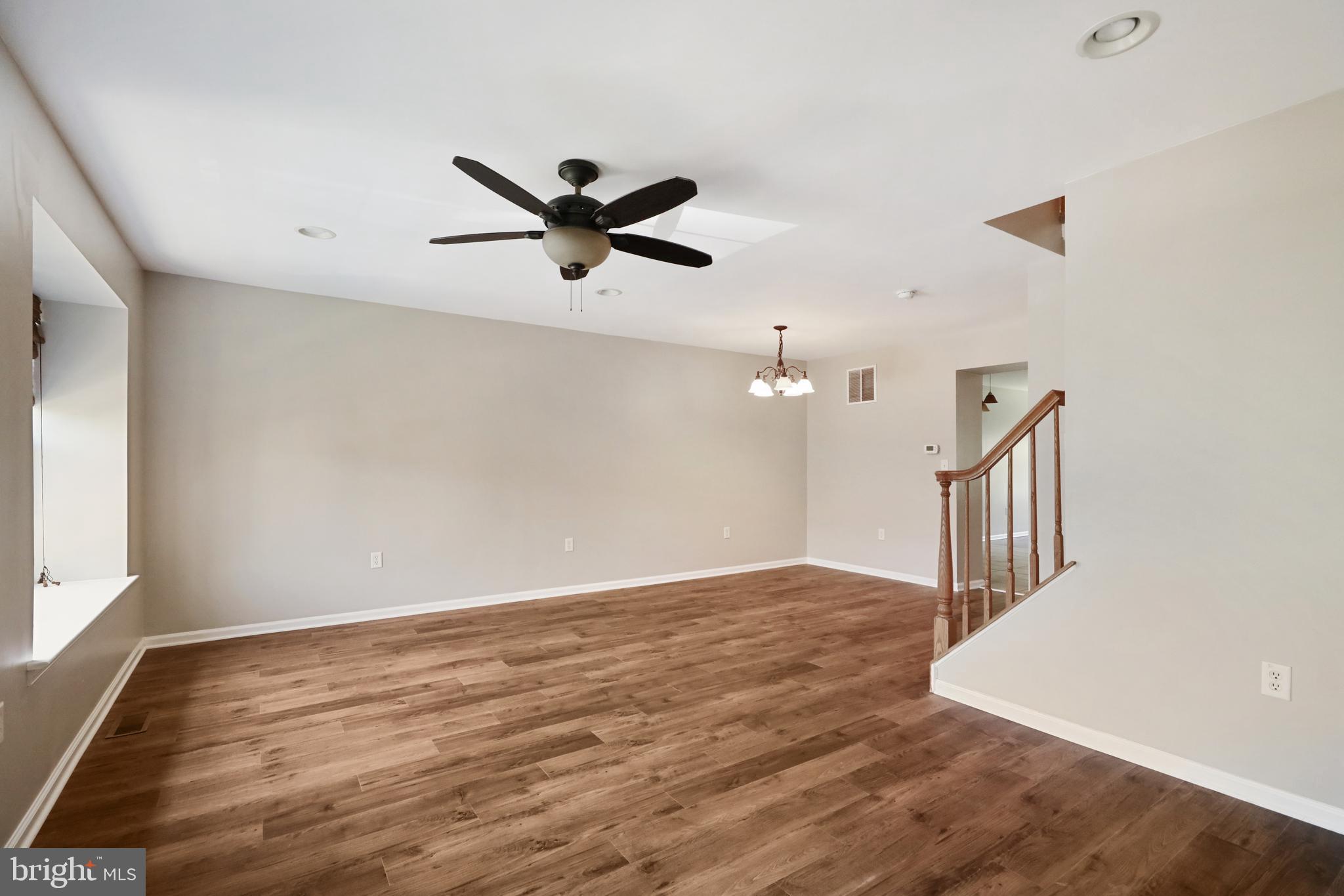 1041 Buckingham Thorofare, NJ 08086 - Photo 22 of 35 an empty room with wooden floor and windows