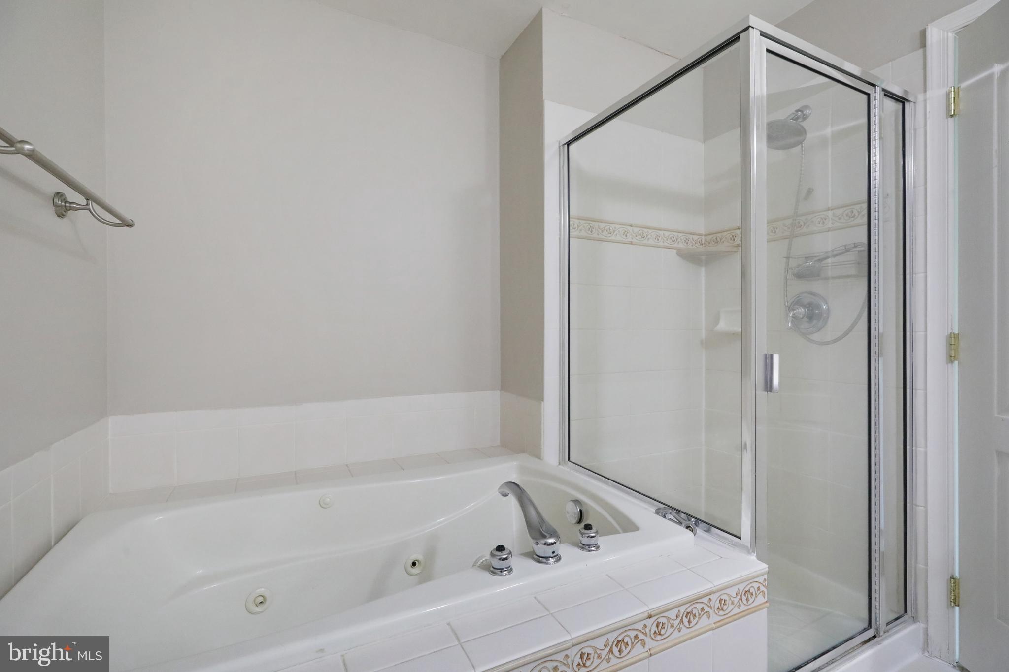 1041 Buckingham Thorofare, NJ 08086 - Photo 27 of 35 a bathroom with a tub and a shower