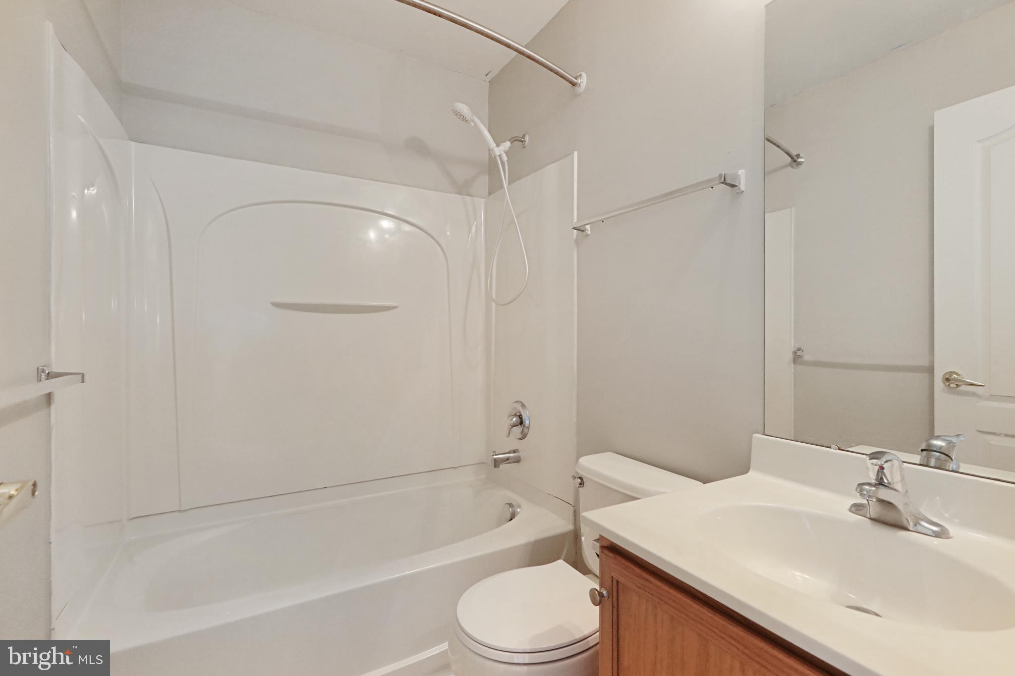 1041 Buckingham Thorofare, NJ 08086 - Photo 30 of 35 a bathroom with a sink toilet and shower