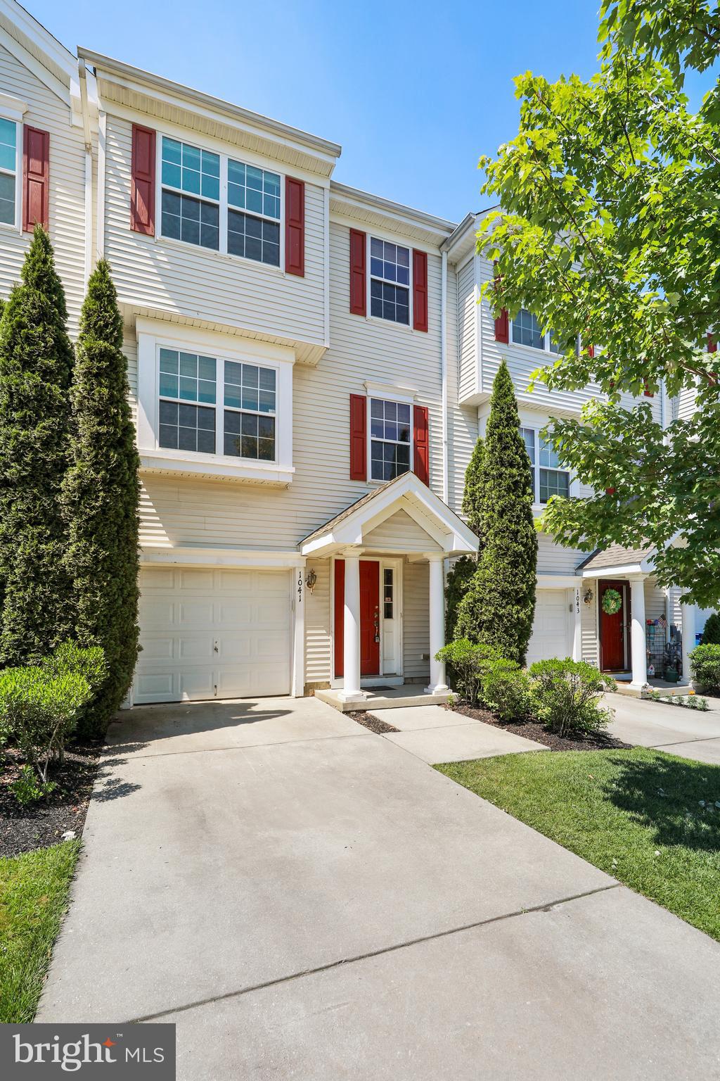 1041 Buckingham Thorofare, NJ 08086 - Photo 3 of 35 a front view of a house with a yard and trees